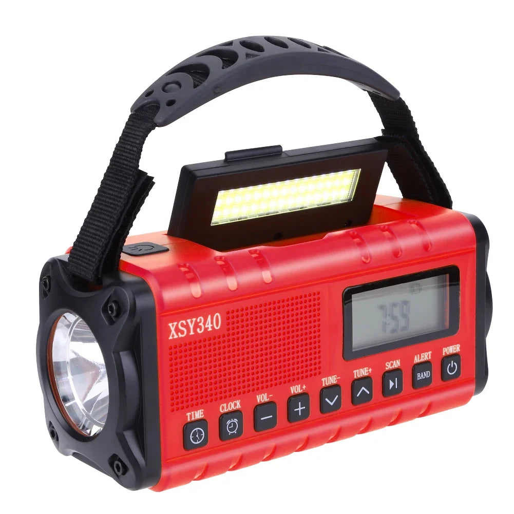 Radio d’urgence solaire à manivelle SONORA, compacte, verte, avec batterie de 12000mAh et fonction de recharge manuelle.